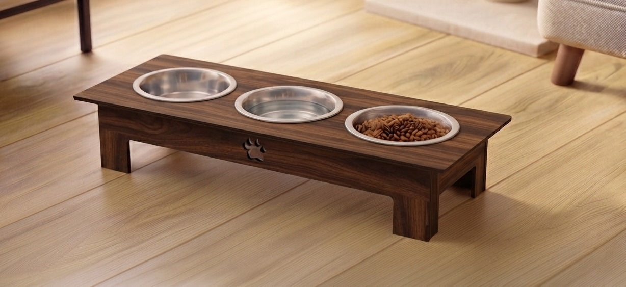 A dark brown wooden elevated pet feeder and water bowl stand with three stainless steel bowls, one containing dry food, placed on a light wood floor.