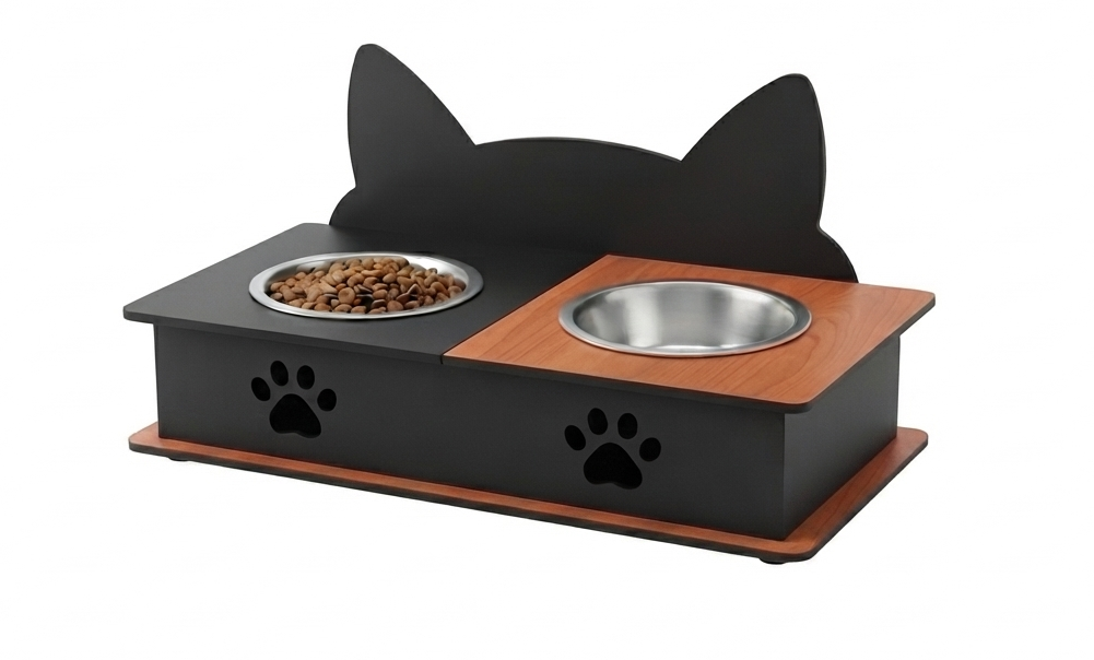 A black cat-shaped elevated pet feeder and waterer with stainless steel bowls, a wood-grain top panel, and paw print cutouts on a white background.