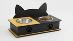 A black cat-shaped pet feeder and waterer with two bowls, one filled with dry food, set against a light gray background.