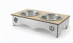 A double pet feeder and waterer elevated stand with a light wood top, stainless steel bowls, and a brushed silver metal base featuring paw print cutouts, shown on a white background.