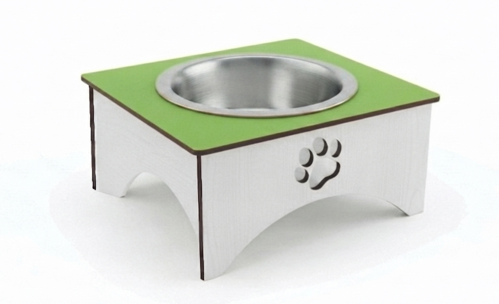 A square elevated pet feeder and water bowl stand with a green top surface, a stainless steel bowl, and a white base featuring a laser-cut paw print.
