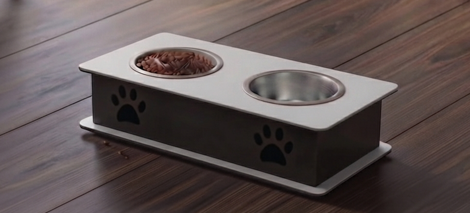 A two-bowl elevated pet feeder and water fountain with a white top tray, dark gray base, and black paw print cutouts, shown on a dark wood floor. One bowl contains wet food.