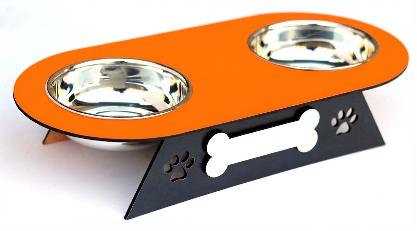 An elevated double pet food bowl set featuring a bright orange top tray with two stainless steel bowls, supported by a black metal stand with a bone-shaped cutout and paw print details.