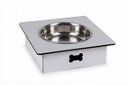 A square stainless steel pet feeder bowl with a white base and a black bone-shaped cutout on the front, shown on a white background.