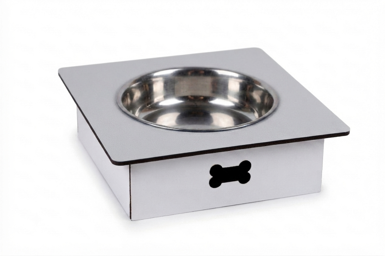 A square stainless steel pet feeder bowl with a white base and a black bone-shaped cutout on the front, shown on a white background.