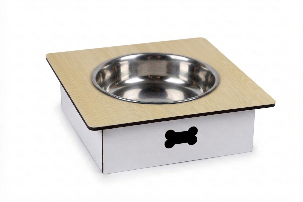 An elevated pet feeder and waterer stand with a light wood-grain top, a stainless steel bowl, and a white base with a black bone-shaped cutout, shown on a white background.