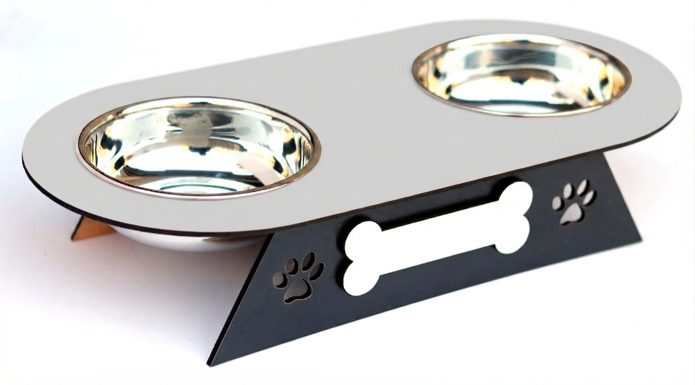 A two-bowl pet feeder and waterer elevated on a black metal stand with bone and paw print cutouts, featuring shiny stainless steel bowls on a white background.