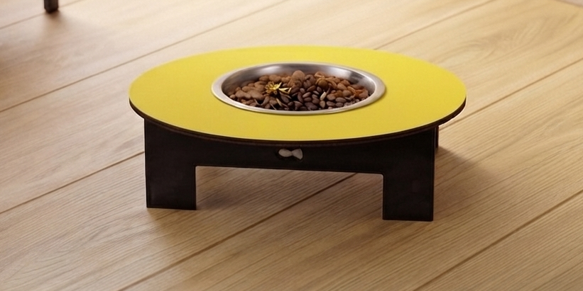 A raised pet feeder table with a bright yellow circular top, a stainless steel bowl filled with kibble, and a dark wooden base, shown on a light wood plank floor.
