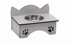 A stainless steel elevated pet feeder and water bowl stand with cat-ear shaped backrest and paw print cutouts on the front, shown on a plain white background.