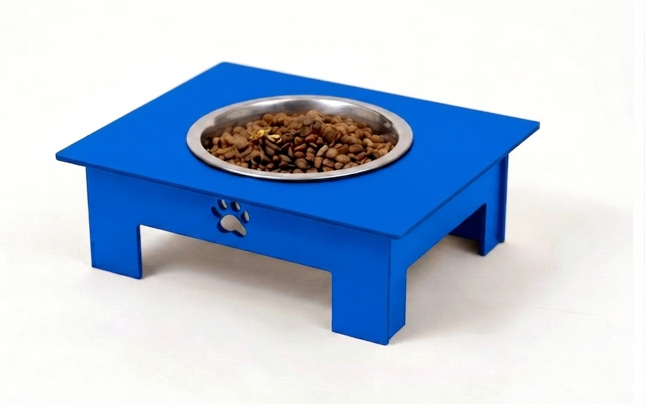 A bright blue elevated pet feeder table with a stainless steel bowl filled with dry kibble, shown on a plain white background.
